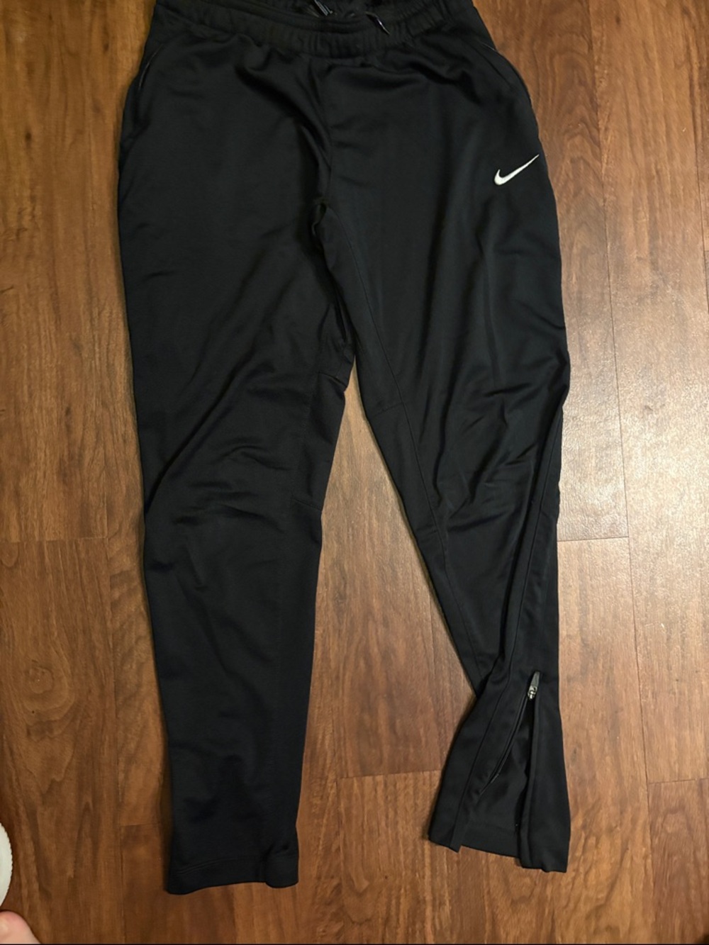 Nike Black Track Pants with White Swoosh and Ankle Zipper